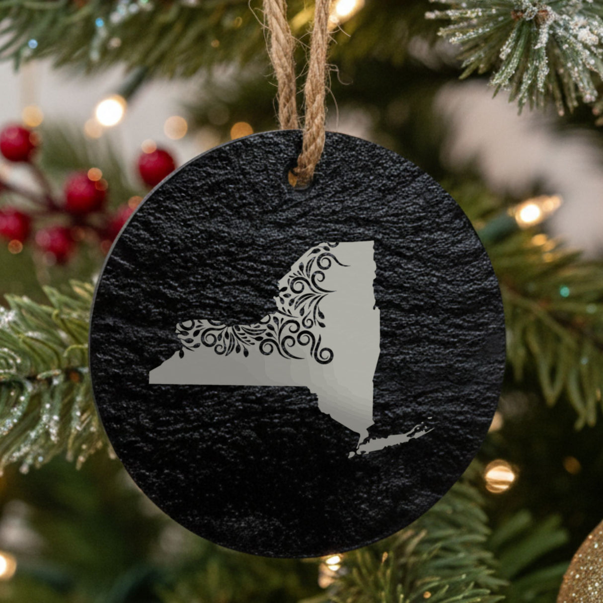 New York round slate Christmas ornament engraved with the state shape in ornate floral scrollwork