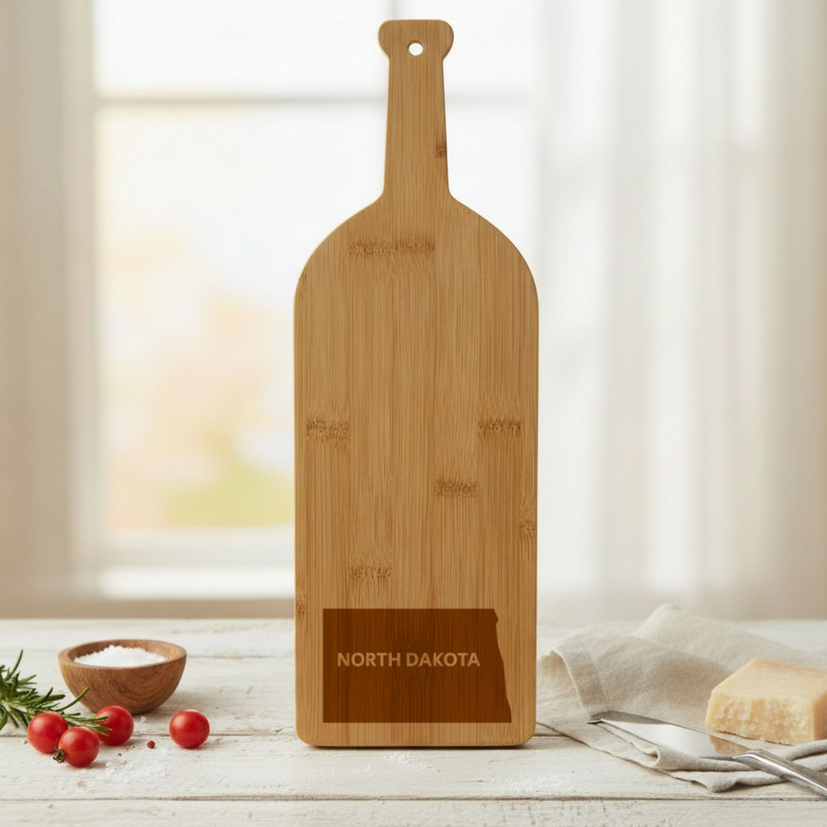 Bamboo wine bottle cutting board engraved with the North Dakota Bold State Name design