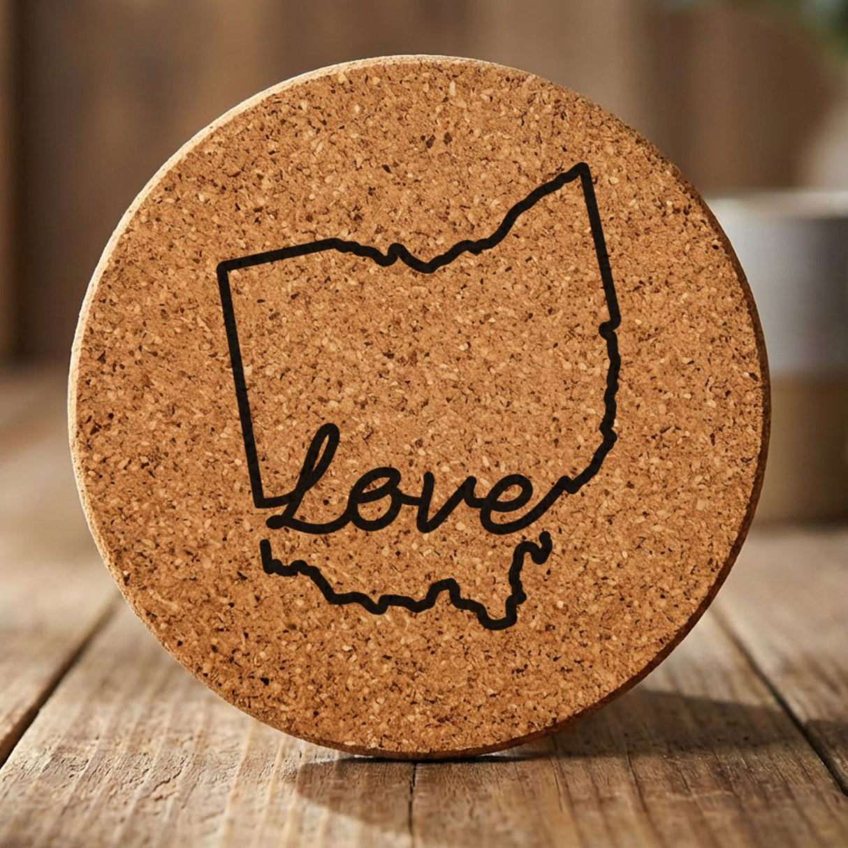 Ohio round cork coaster engraved with a hand-drawn state outline and love in cursive