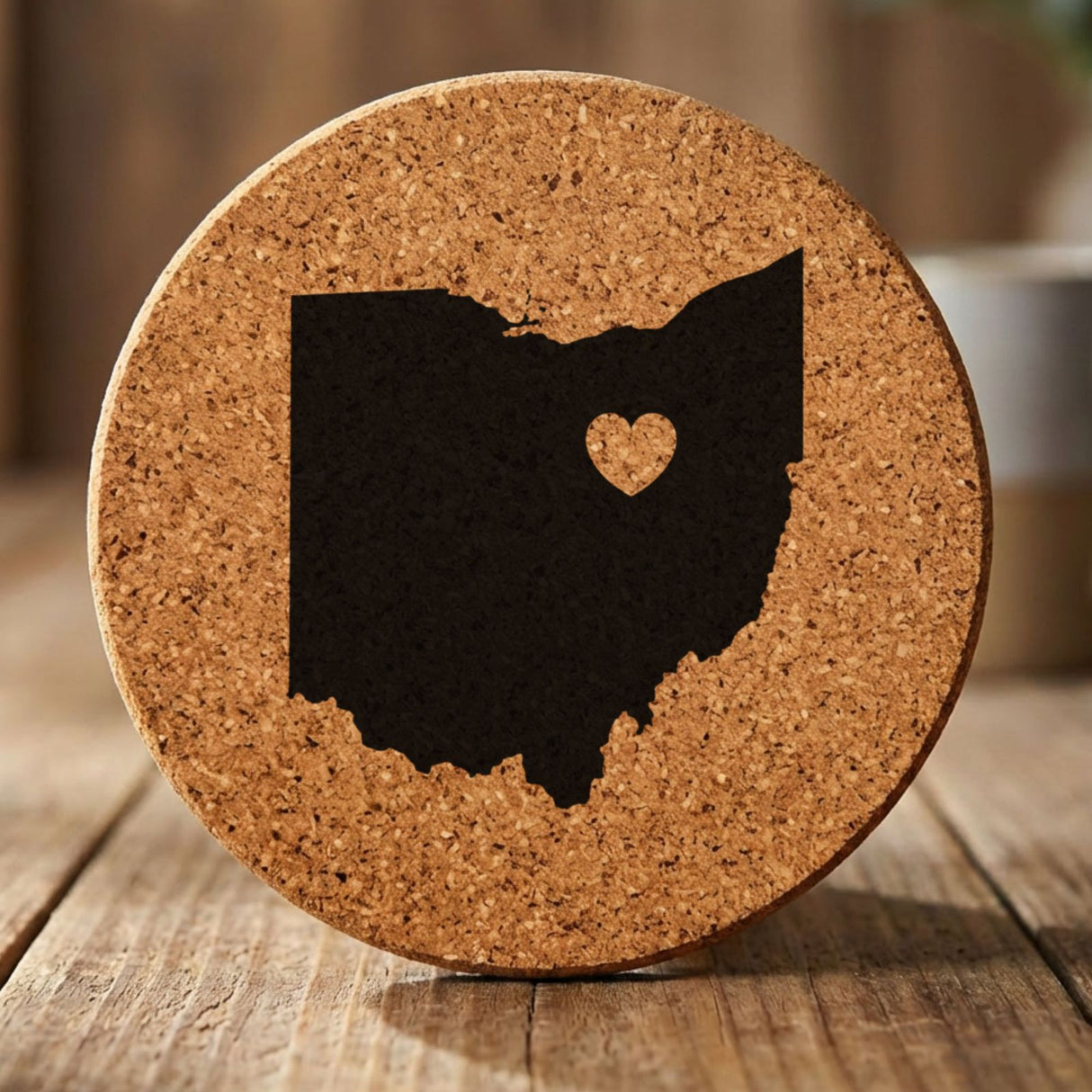 Ohio round cork coaster engraved with the state shape and a heart