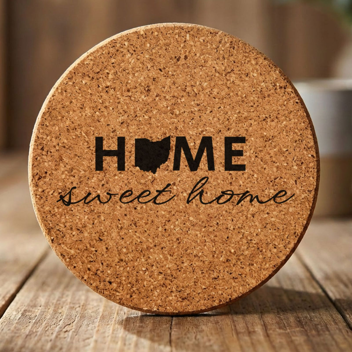 Ohio round cork coaster engraved with HOME sweet home using the state shape as the letter O
