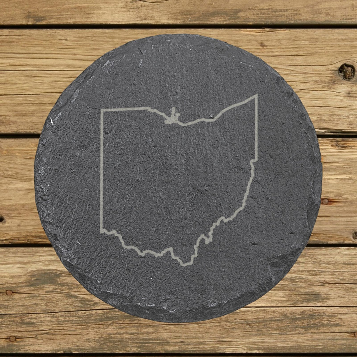 Ohio round slate coaster engraved with a clean state outline