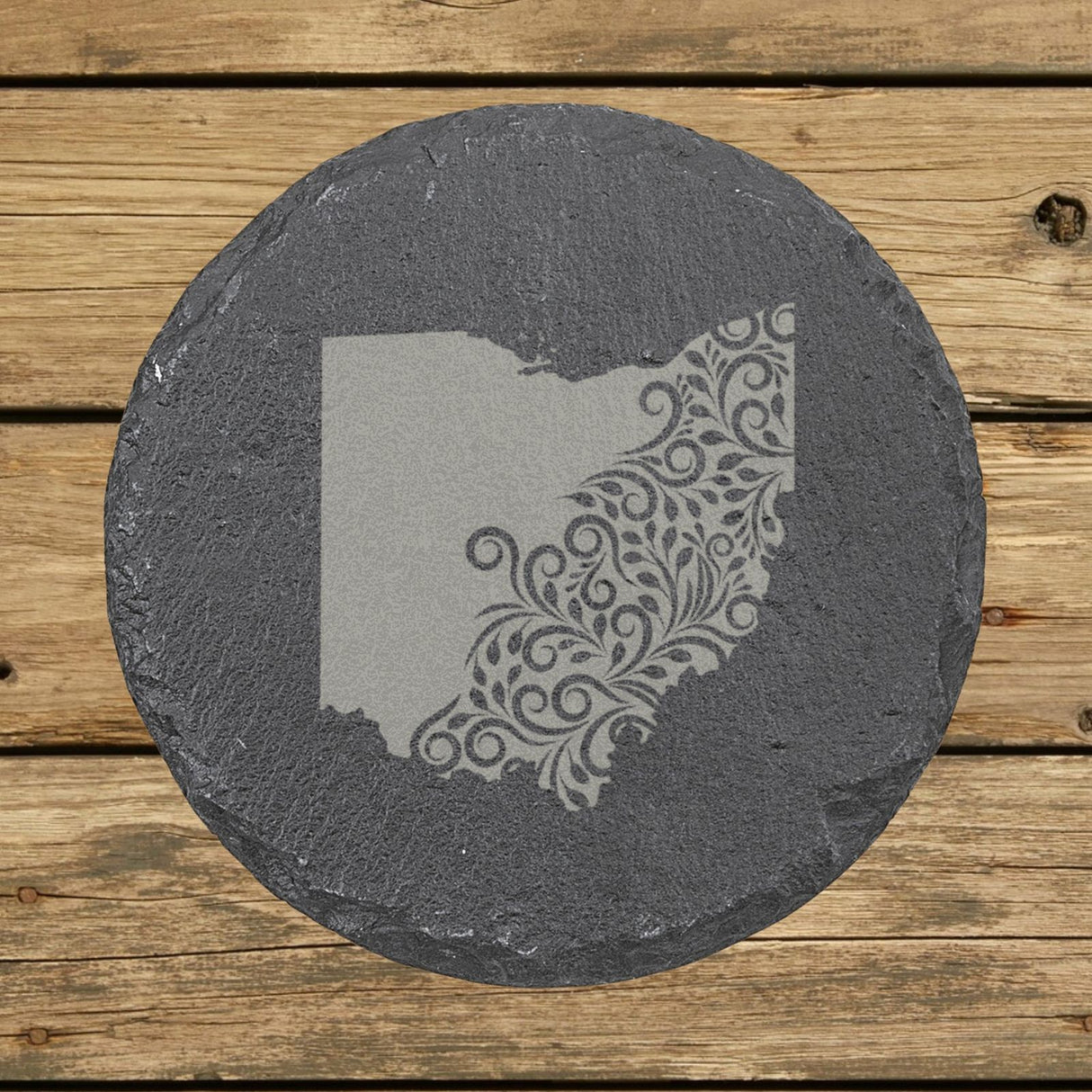 Ohio round slate coaster engraved with the state shape in ornate floral scrollwork