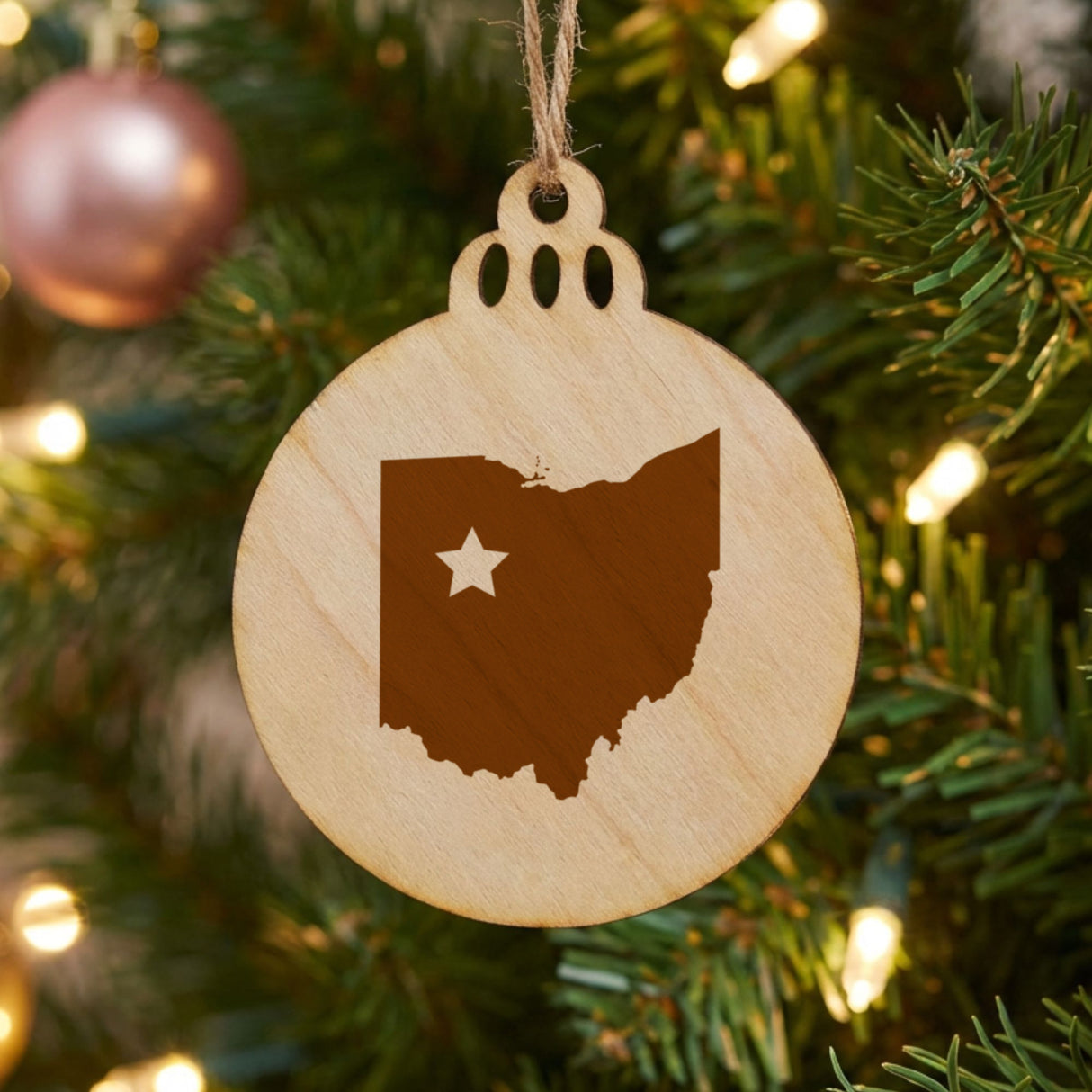Ohio round wood Christmas ornament engraved with the state shape and a star