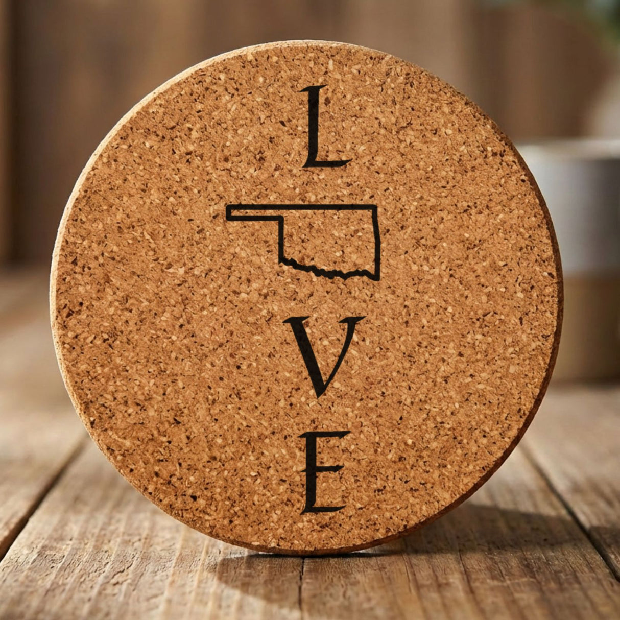Oklahoma round cork coaster engraved with LOVE stacked vertically using the state as the letter O