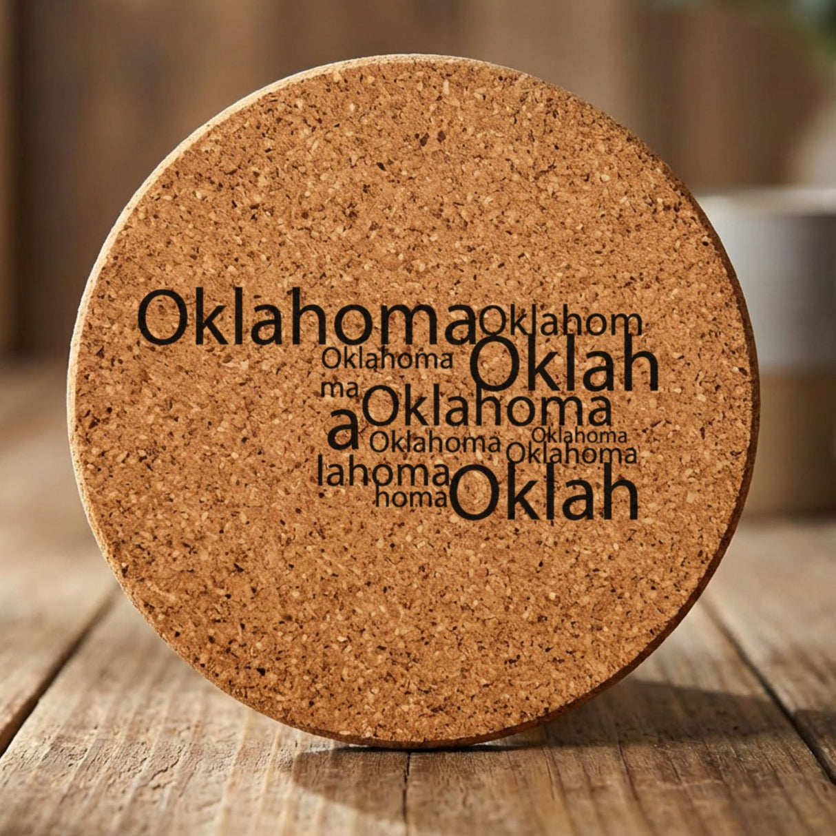 Oklahoma round cork coaster engraved with a word cloud of repeating Oklahoma text