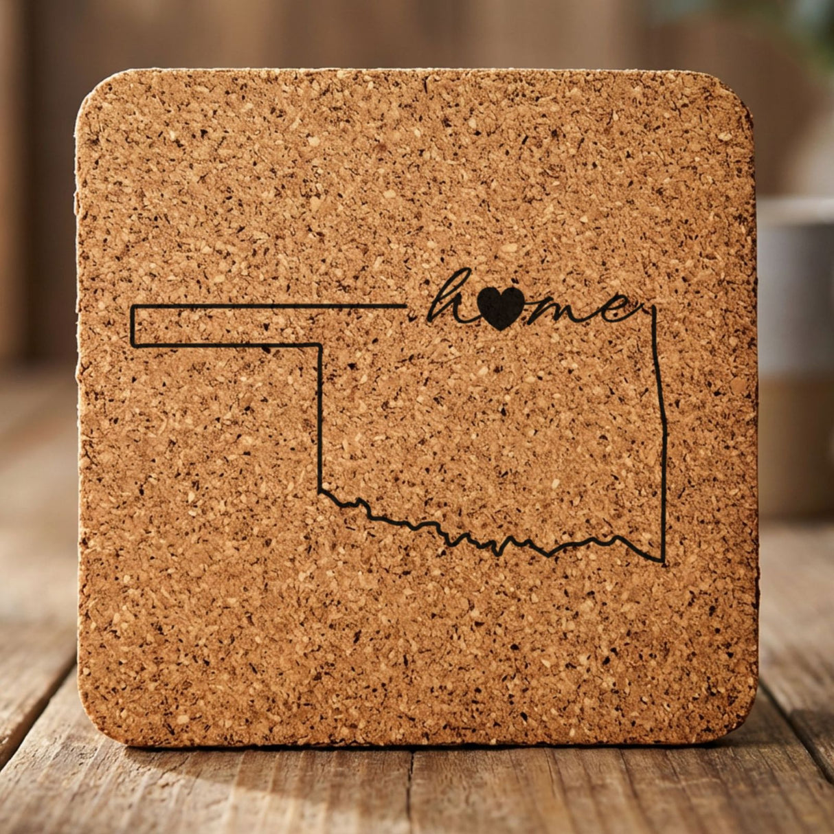 Oklahoma square cork coaster engraved with the state outline and home in script with a heart