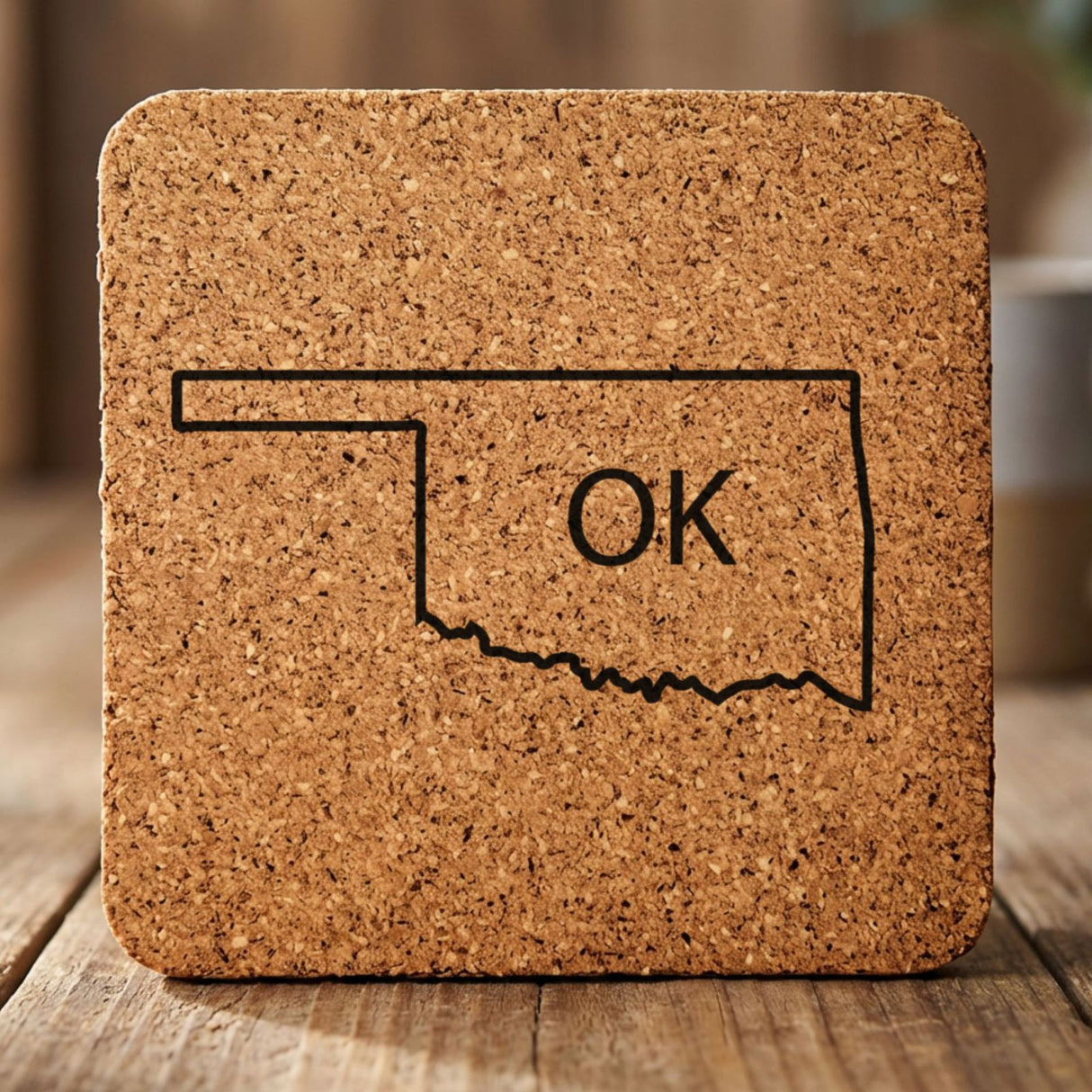 Oklahoma square cork coaster engraved with the state outline and OK initials