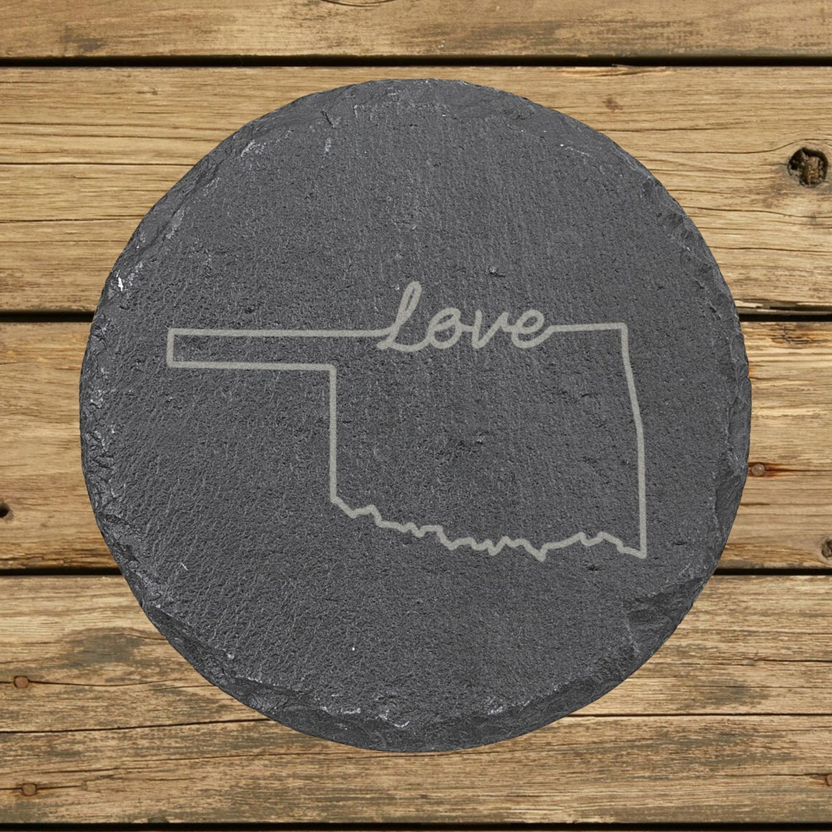 Oklahoma round slate coaster engraved with a hand-drawn state outline and love in cursive