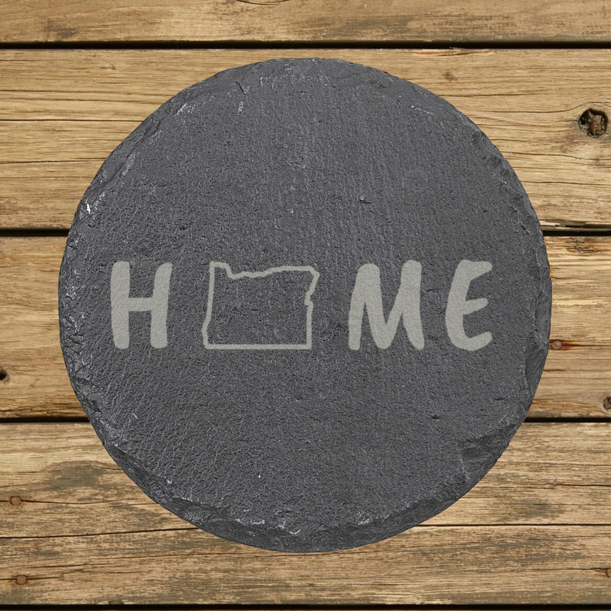 Oregon round slate coaster engraved with HOME using the state outline as the letter O