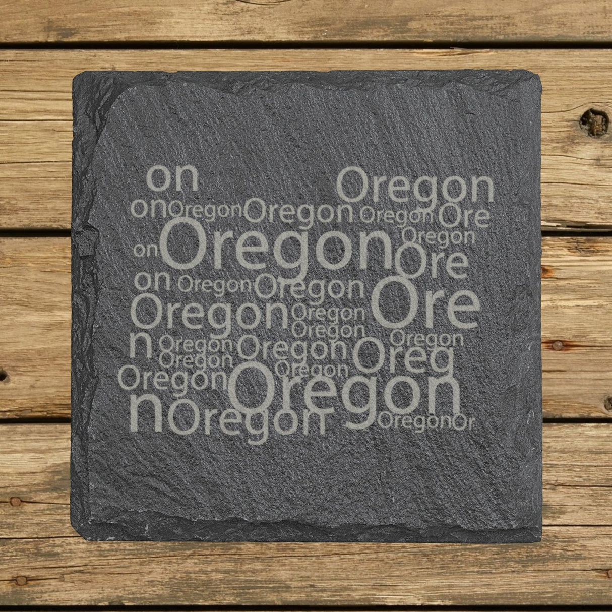Oregon square slate coaster engraved with a word cloud of repeating Oregon text