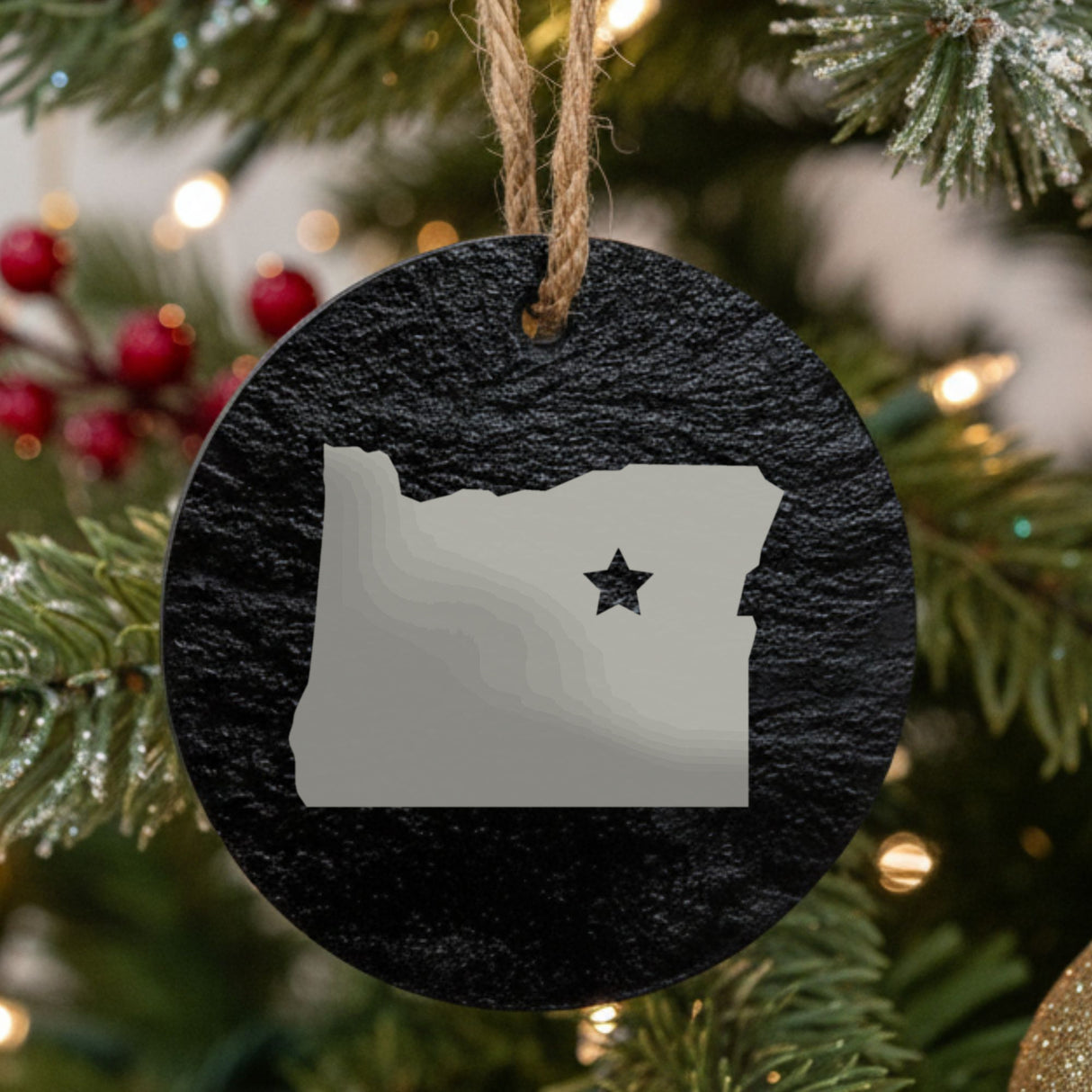Oregon round slate Christmas ornament engraved with the state shape and a star