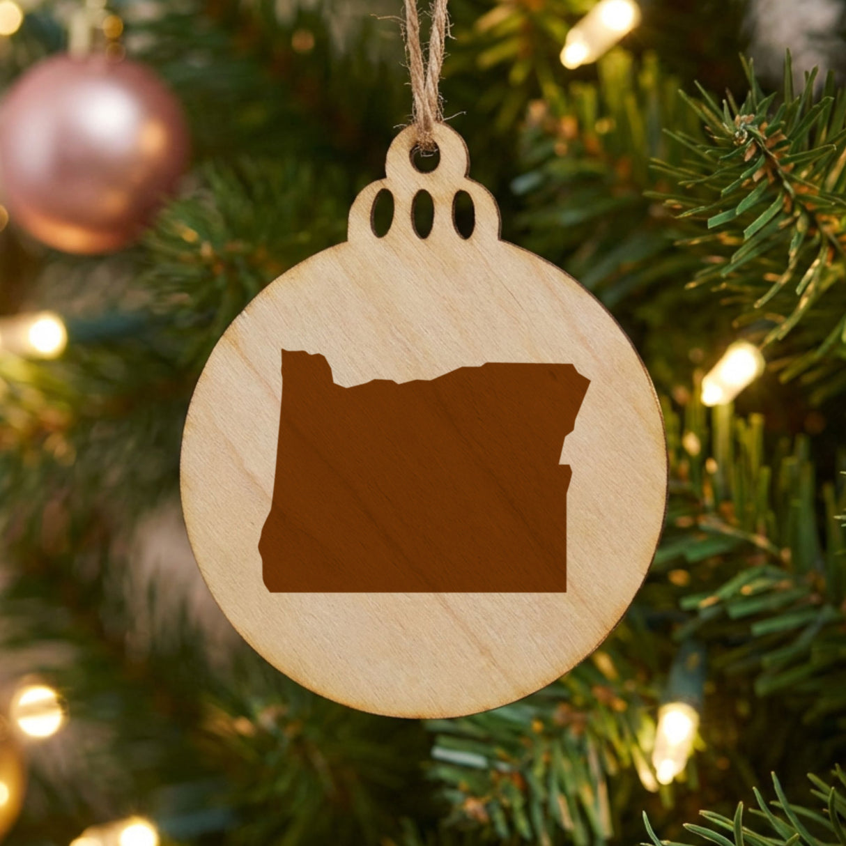 Oregon round wood Christmas ornament with the full state shape engraved
