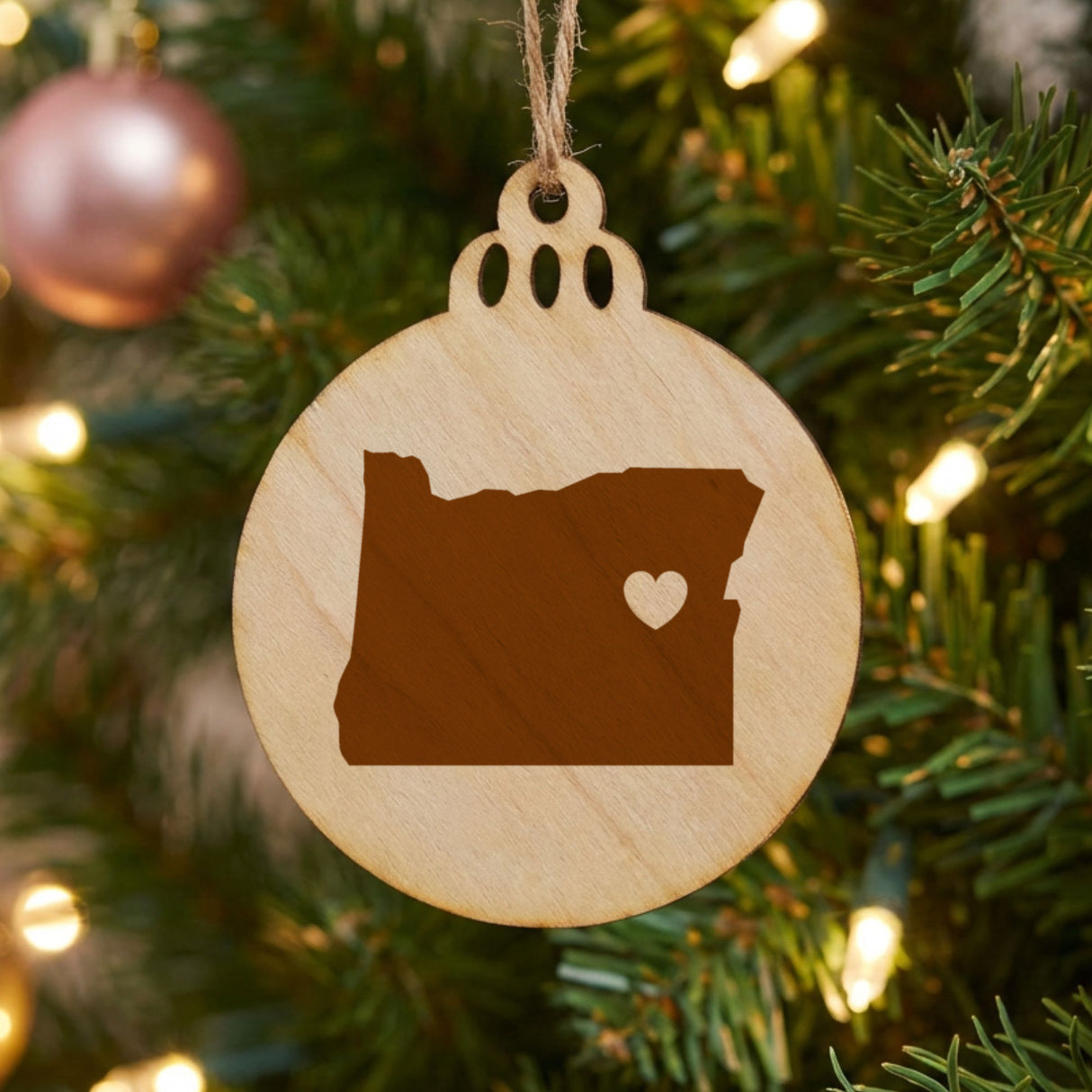 Oregon round wood Christmas ornament engraved with the state shape and a heart
