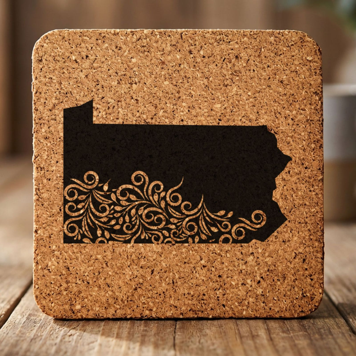 Pennsylvania square cork coaster engraved with the state shape in ornate floral scrollwork