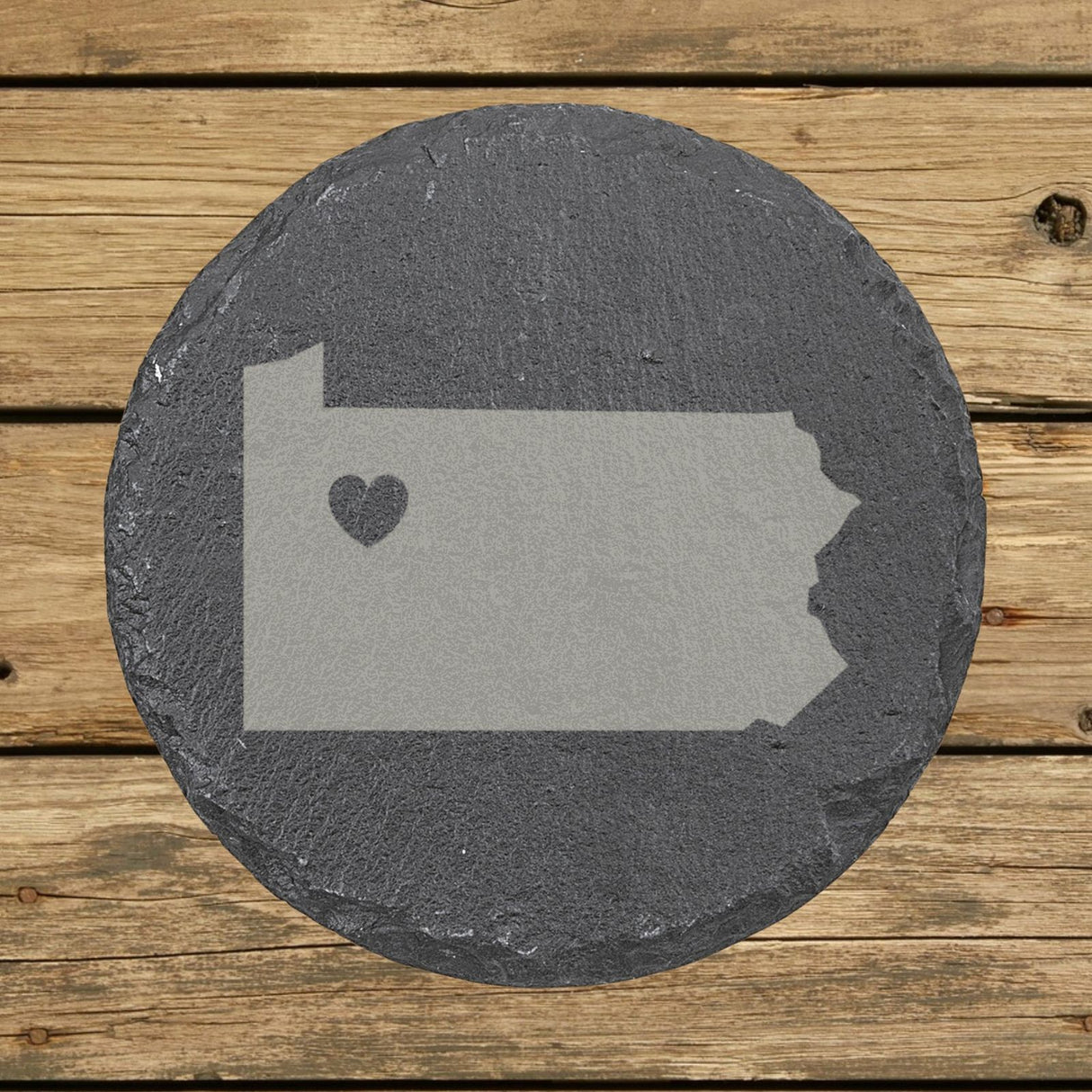 Pennsylvania round slate coaster engraved with the state shape and a heart