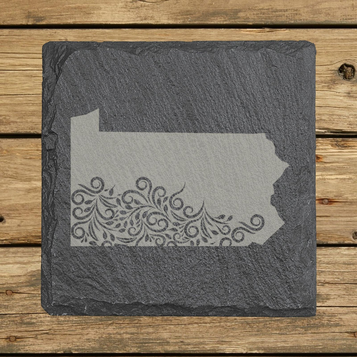 Pennsylvania square slate coaster engraved with the state shape in ornate floral scrollwork