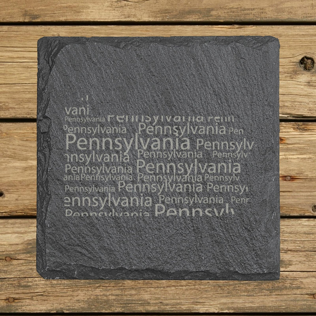 Pennsylvania square slate coaster engraved with a word cloud of repeating Pennsylvania text