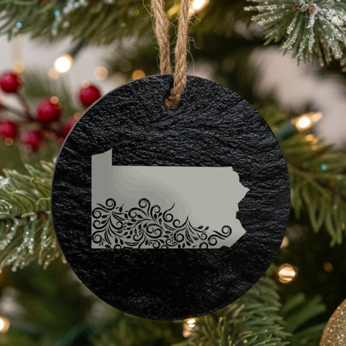 Pennsylvania round slate Christmas ornament engraved with the state shape in ornate floral scrollwork