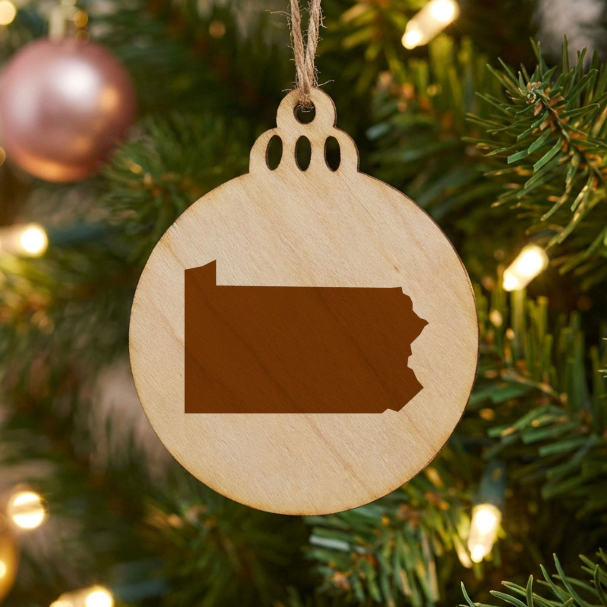 Pennsylvania round wood Christmas ornament with the full state shape engraved