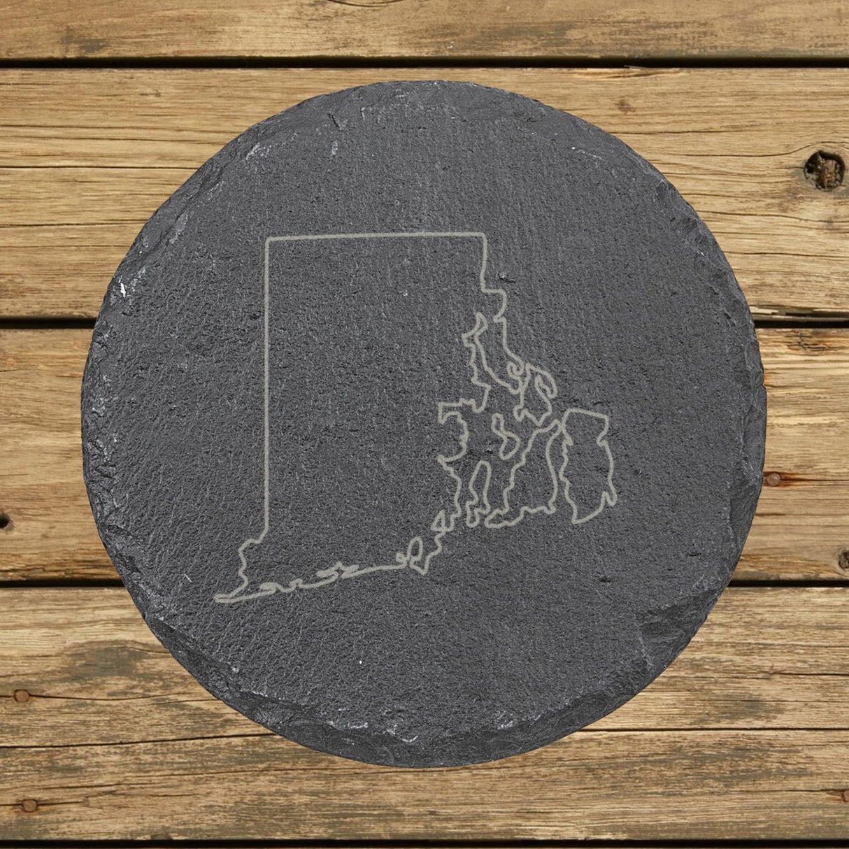 Rhode Island round slate coaster engraved with a clean state outline