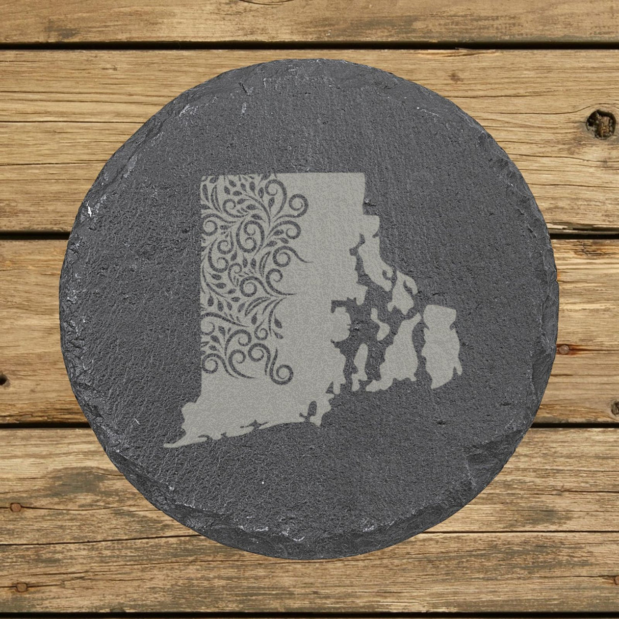 Rhode Island round slate coaster engraved with the state shape in ornate floral scrollwork