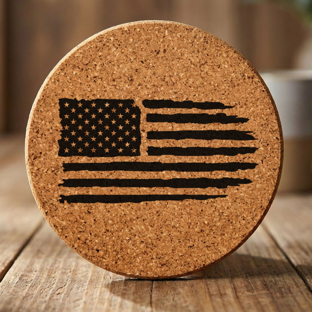 Round cork coaster laser engraved with an American flag, distressed design