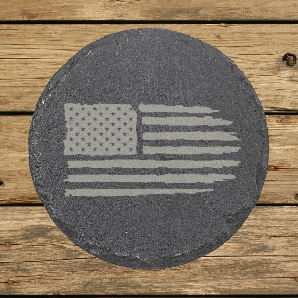 Round slate coaster laser engraved with an American flag, distressed design