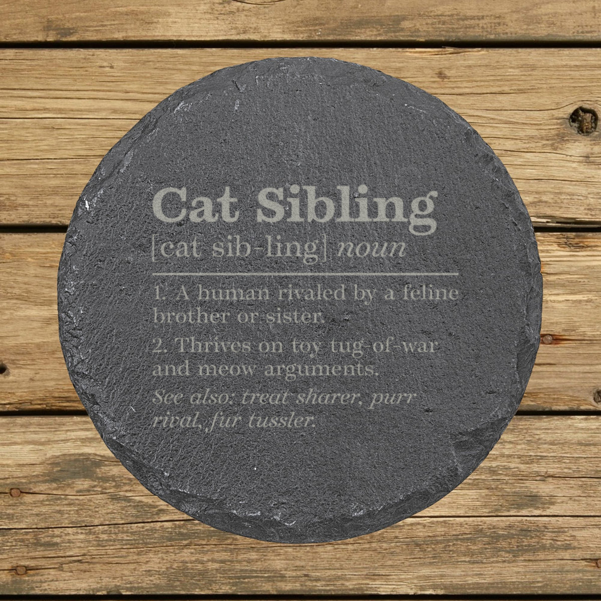 Round slate coaster laser engraved with the Cat Sibling definition