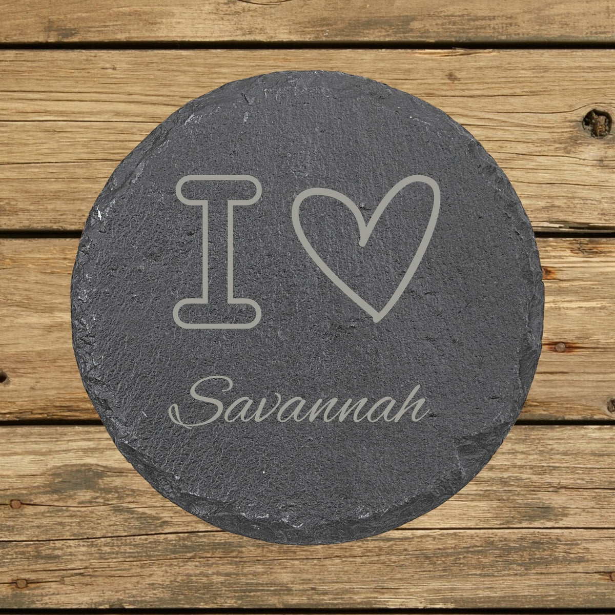 Round slate coaster laser engraved with a custom zip code design