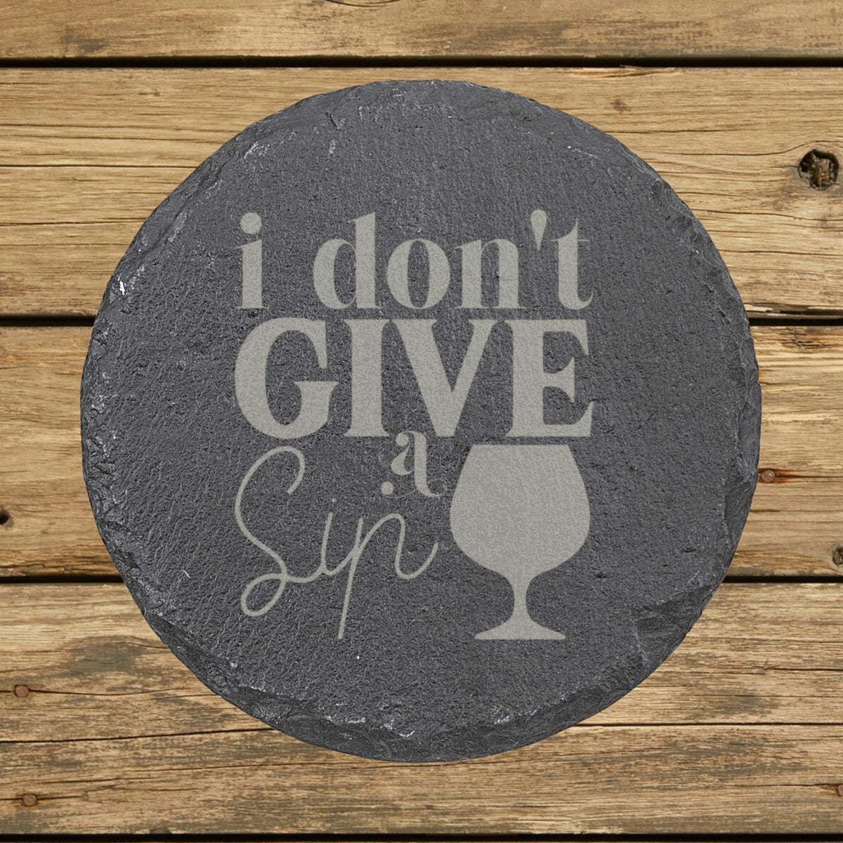 Round slate coaster laser engraved with "I Don't Give a Sip"