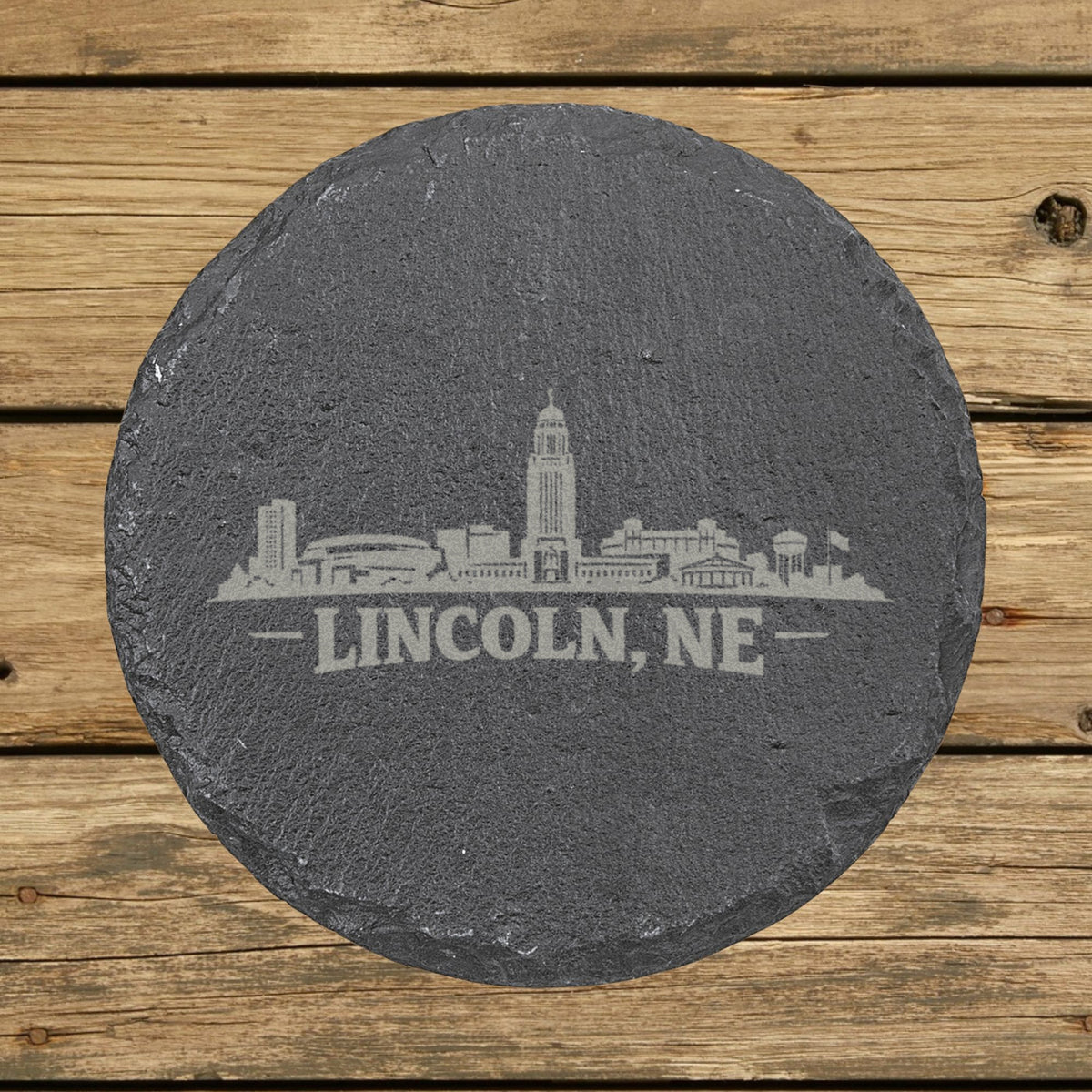 Round slate coaster laser engraved with the Lincoln, Nebraska skyline
