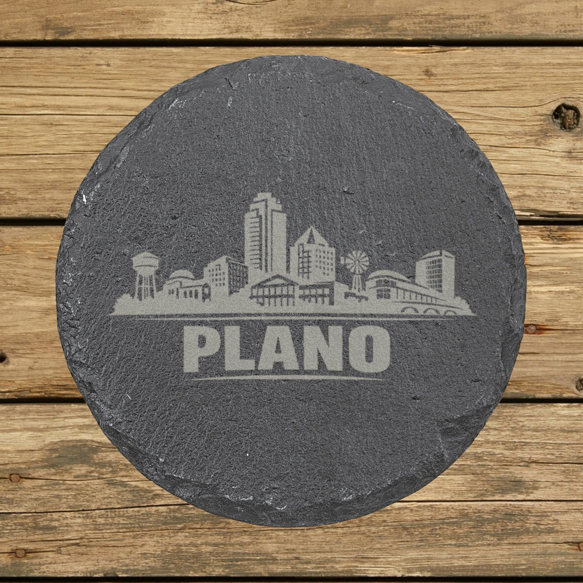 Round slate coaster laser engraved with the Plano, Texas skyline