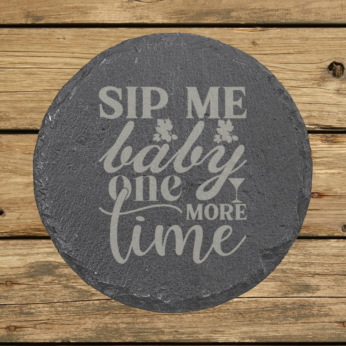 Round slate coaster laser engraved with "Sip Me Baby One More Time"