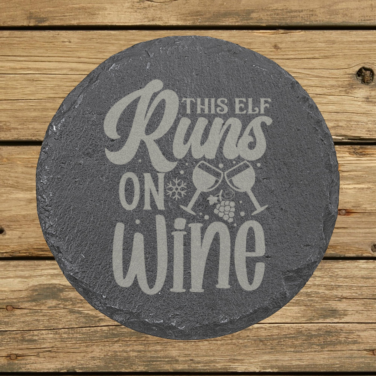 Round slate coaster laser engraved with "This Elf Runs on Wine"