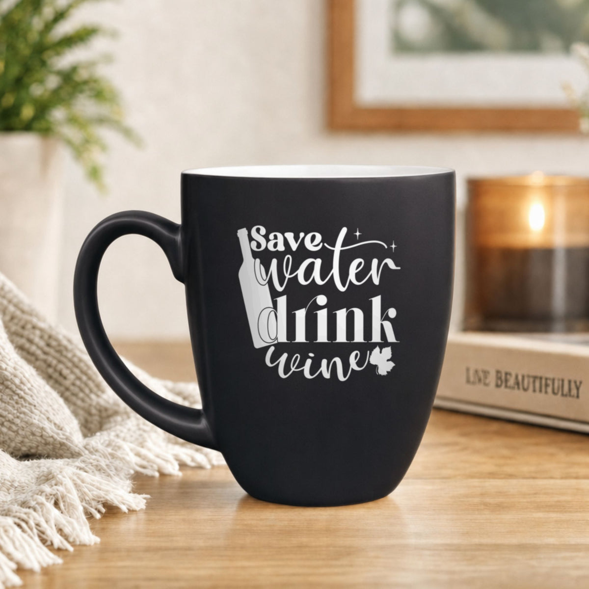 16 oz black ceramic coffee mug with "Save Water, Drink Wine (Block)"