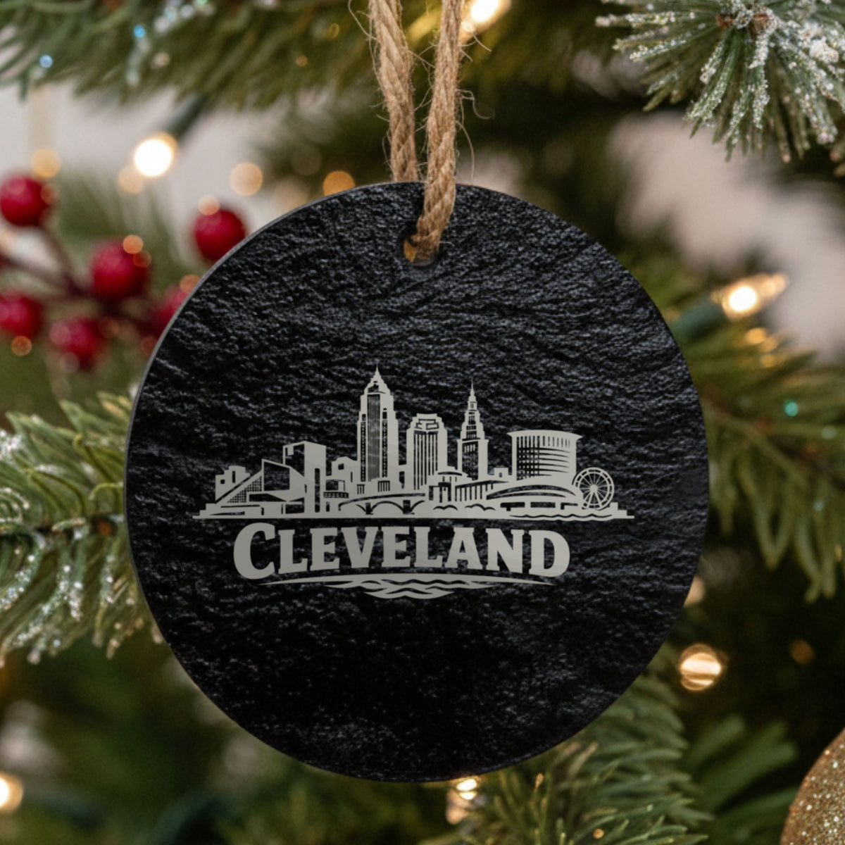 Cleveland, Ohio skyline engraved on a round slate Christmas ornament