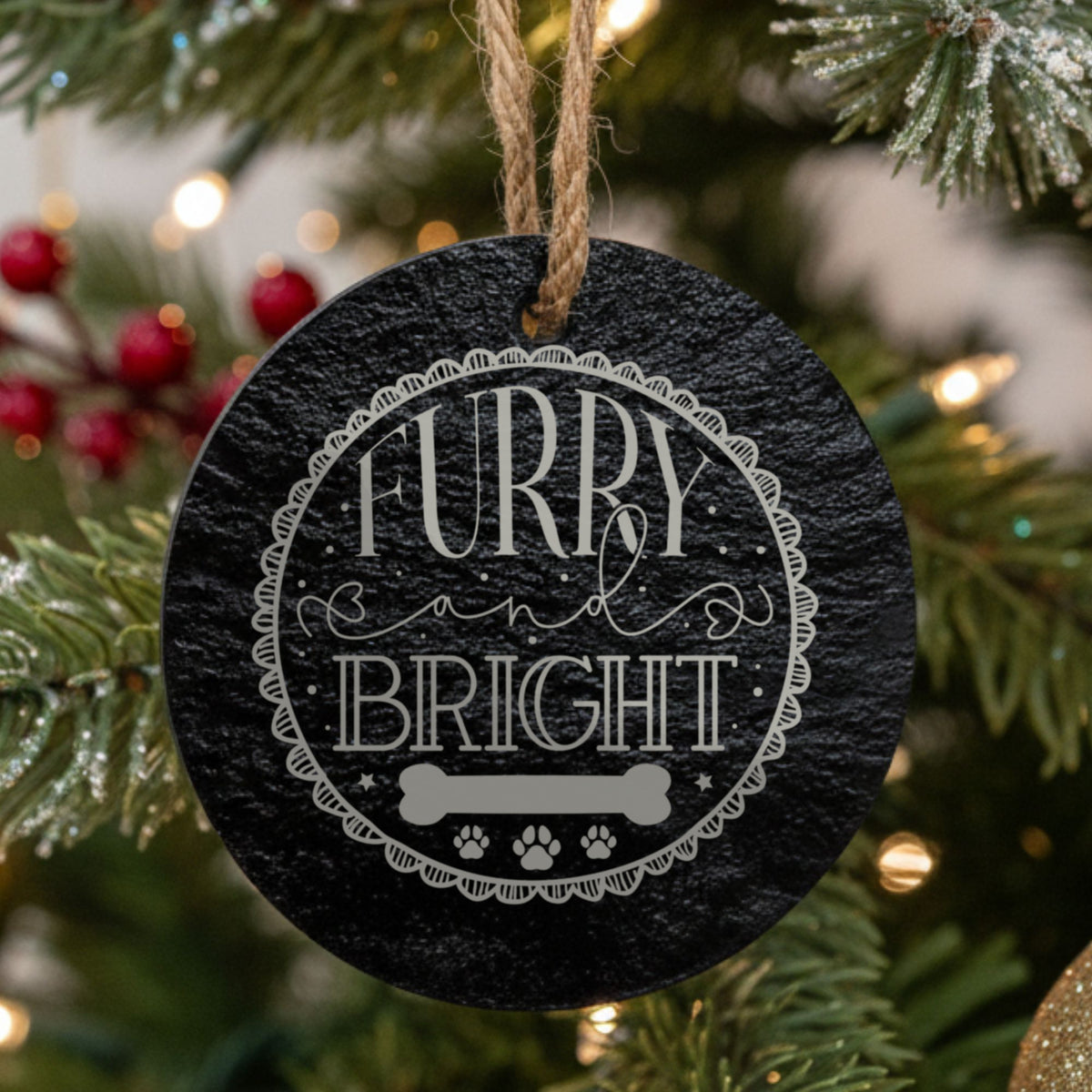 Round black slate Christmas ornament, laser engraved in white with Furry and Bright and a dog bone