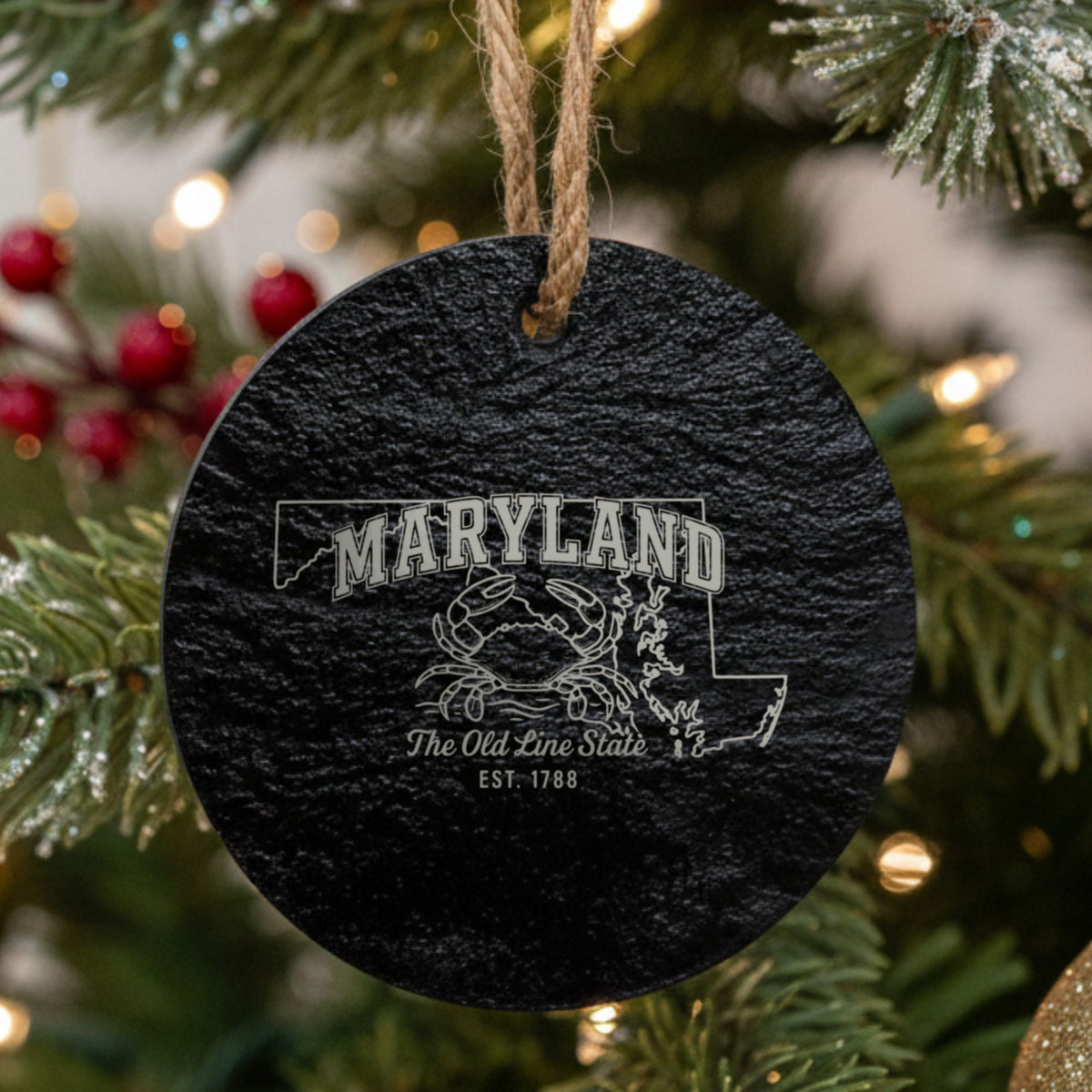 Round slate Christmas ornament laser engraved with a Maryland design of a blue crab on the Chesapeake