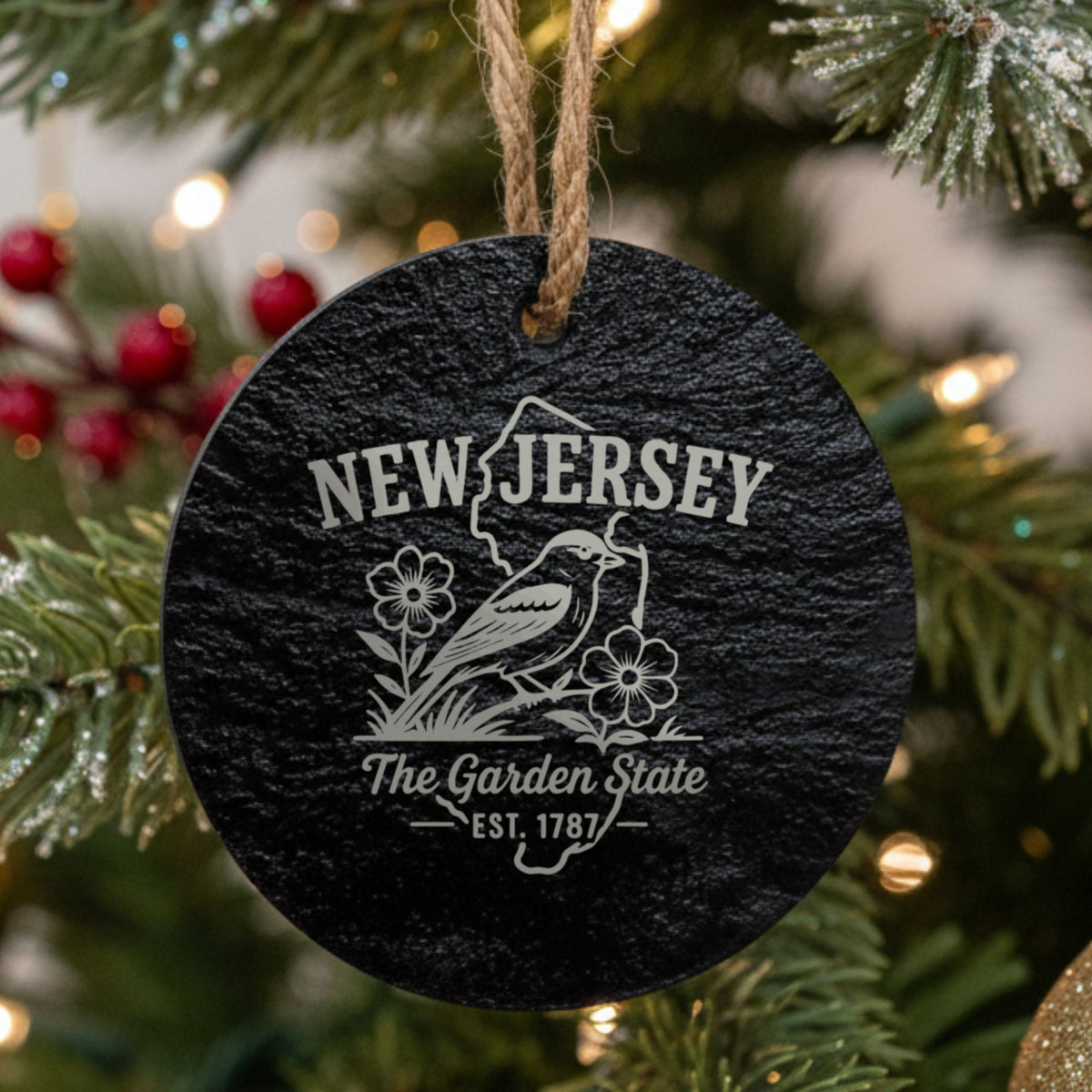 Round slate Christmas ornament laser engraved with a New Jersey design of an American goldfinch and violets