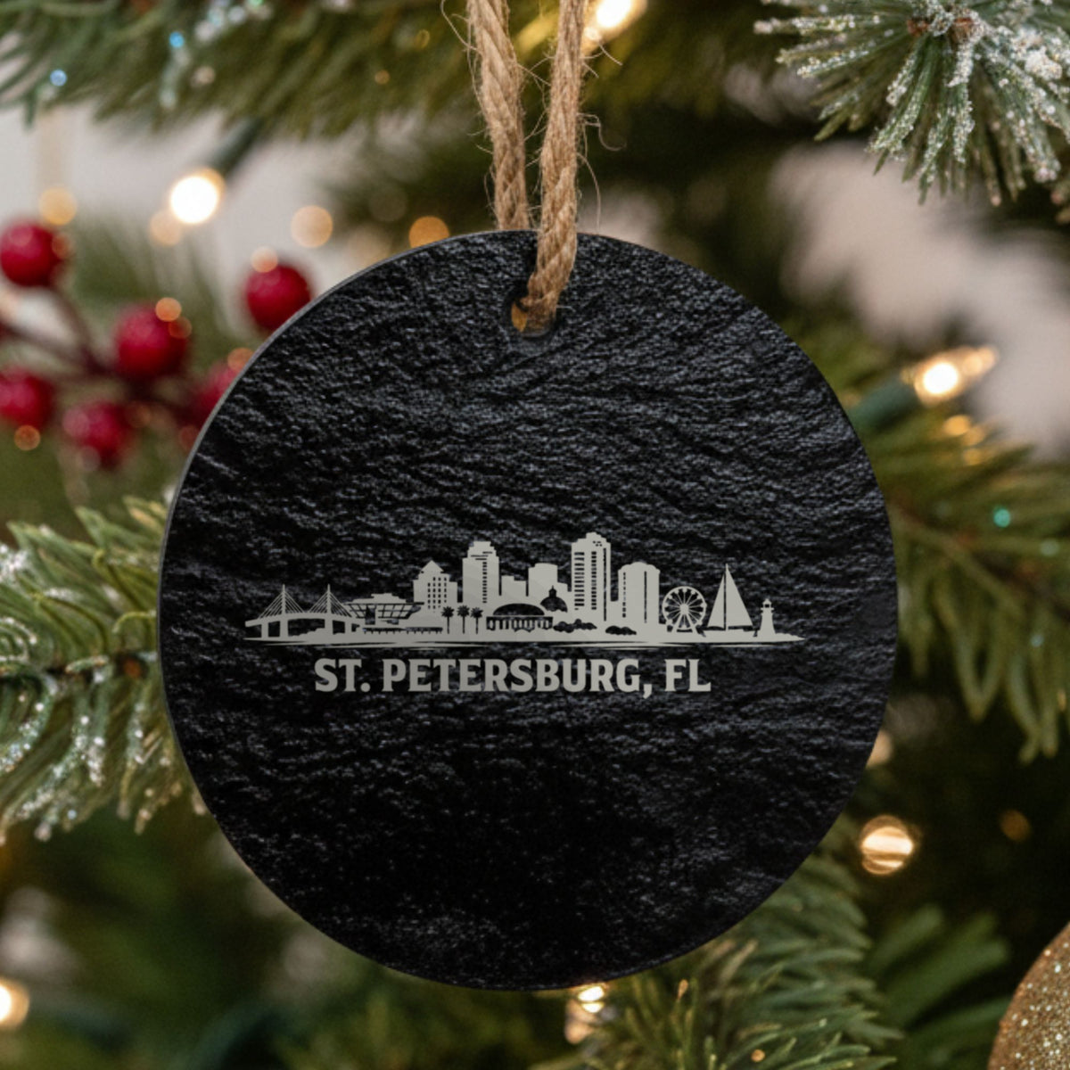 St. Petersburg, Florida skyline engraved on a round slate Christmas ornament