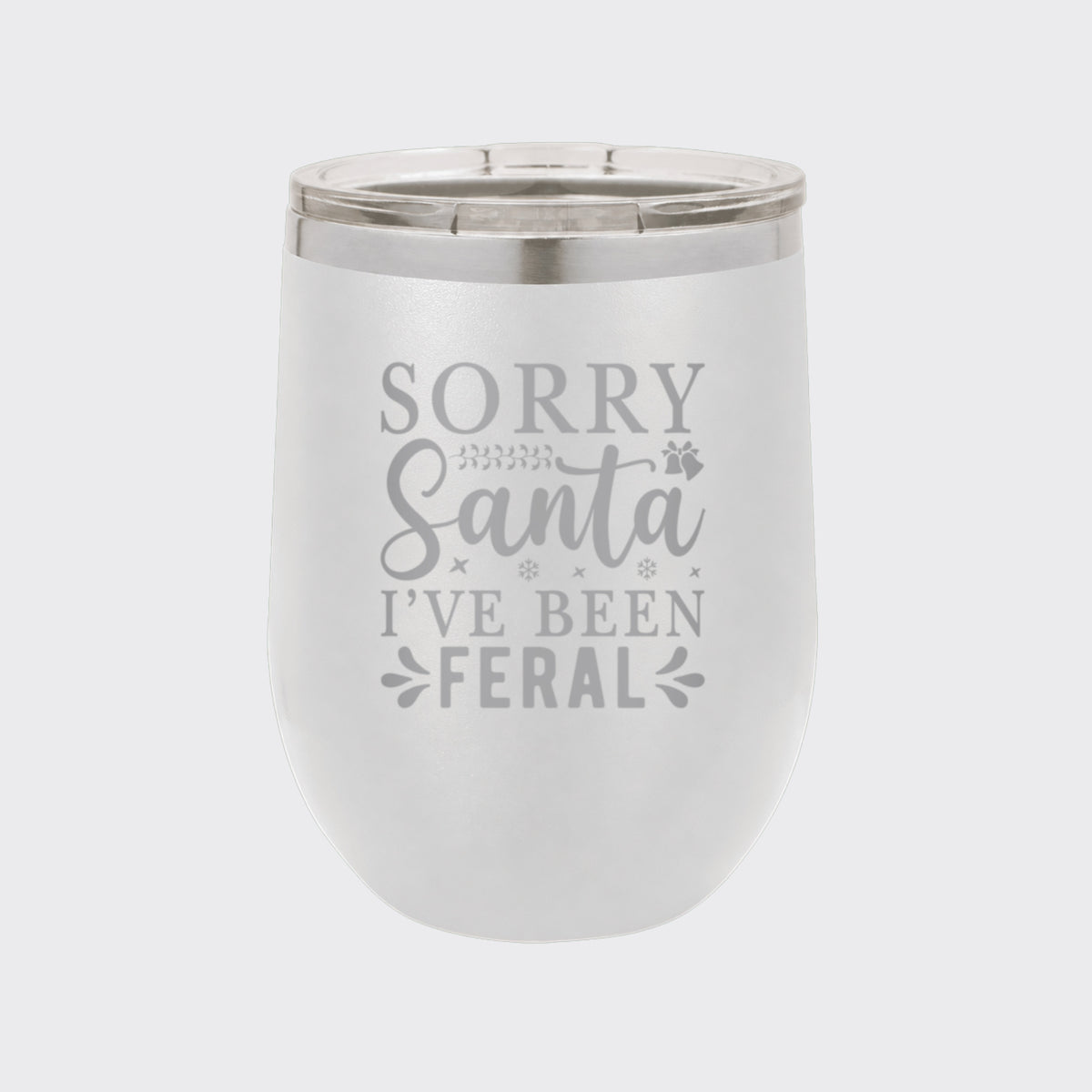 White 12 oz stemless wine tumbler laser engraved with "Sorry Santa, I've Been Feral"