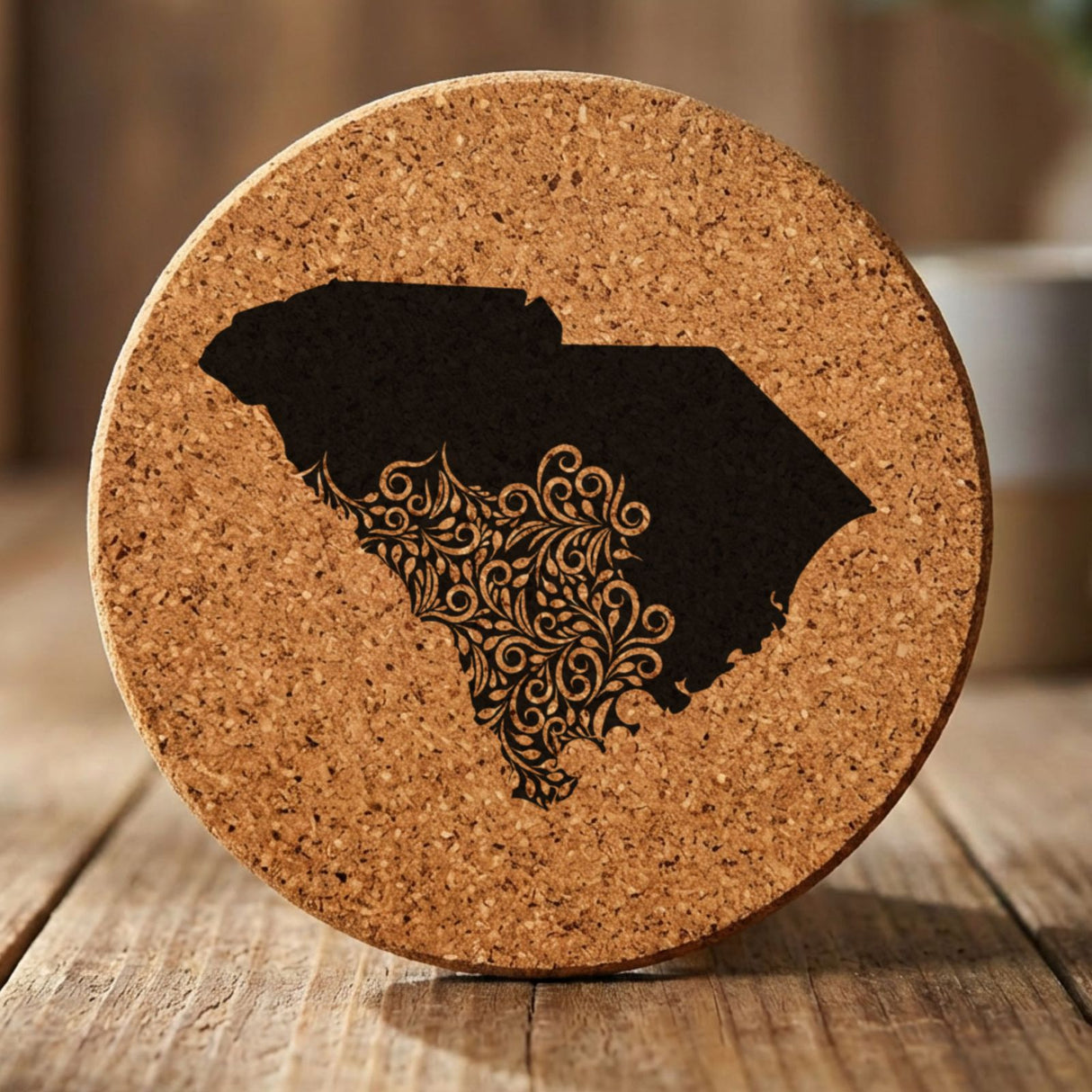 South Carolina round cork coaster engraved with the state shape in ornate floral scrollwork
