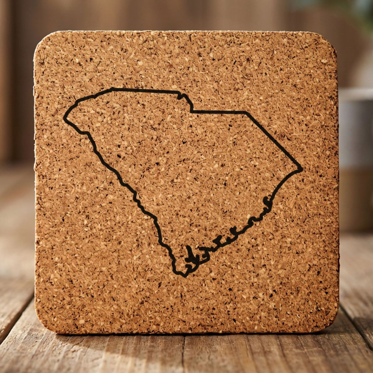South Carolina square cork coaster engraved with a clean state outline