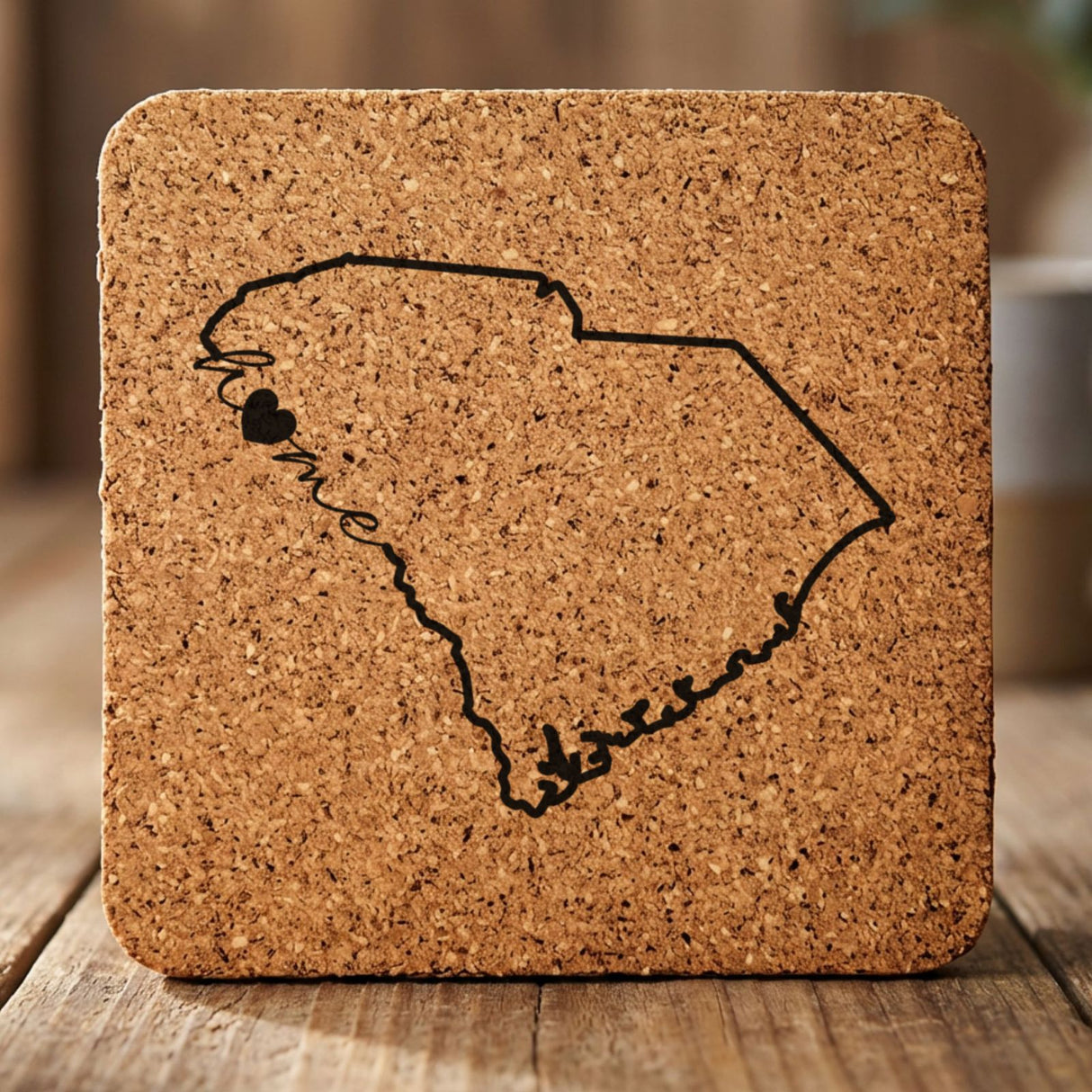 South Carolina square cork coaster engraved with the state outline and home in script with a heart