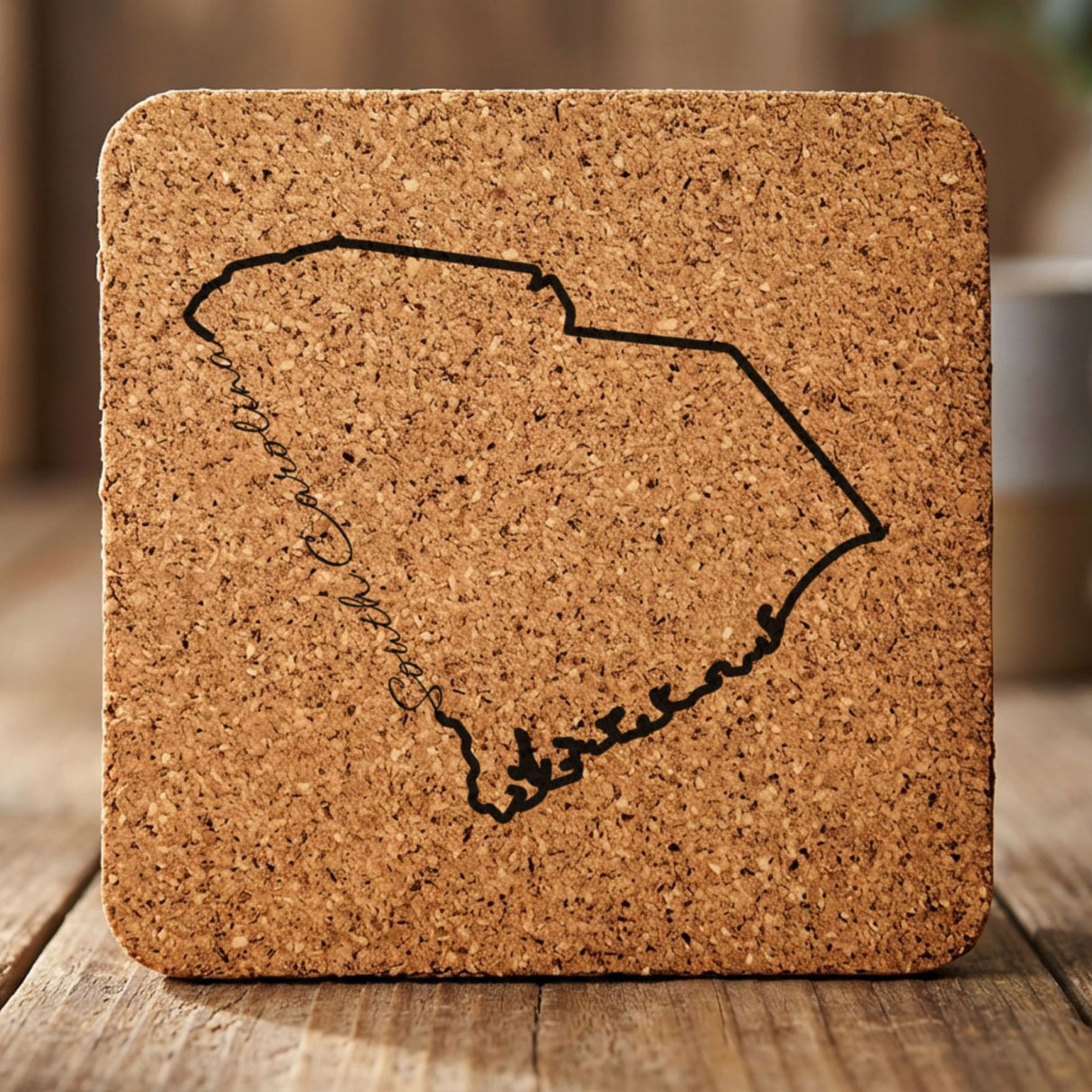 South Carolina square cork coaster engraved with the state outline and South Carolina in script lettering