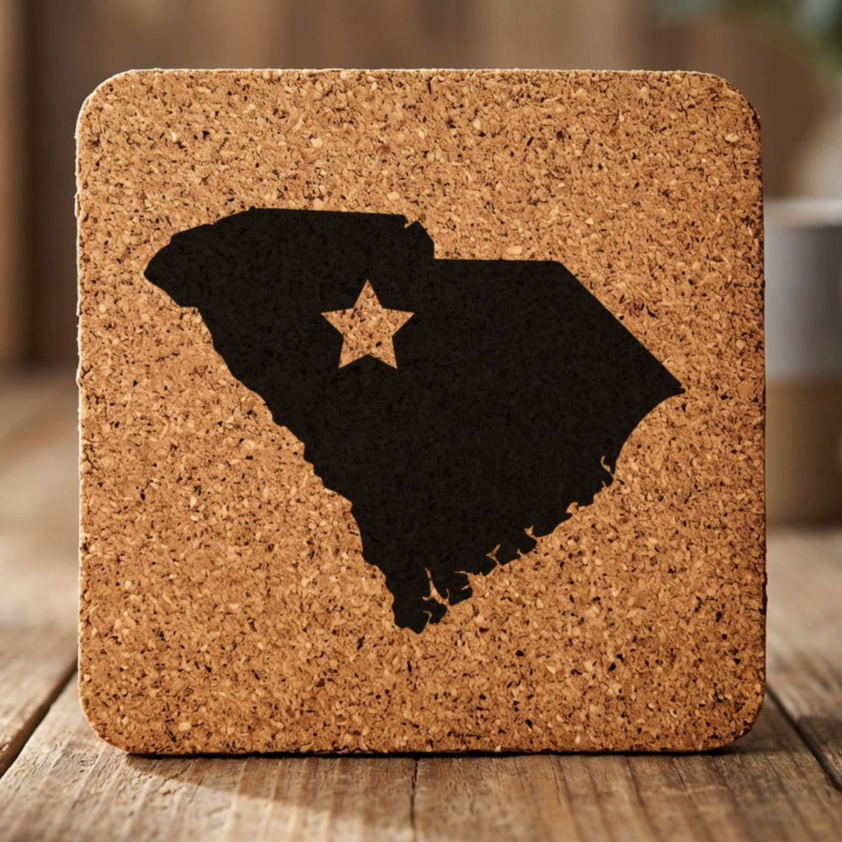 South Carolina square cork coaster engraved with the state shape and a star