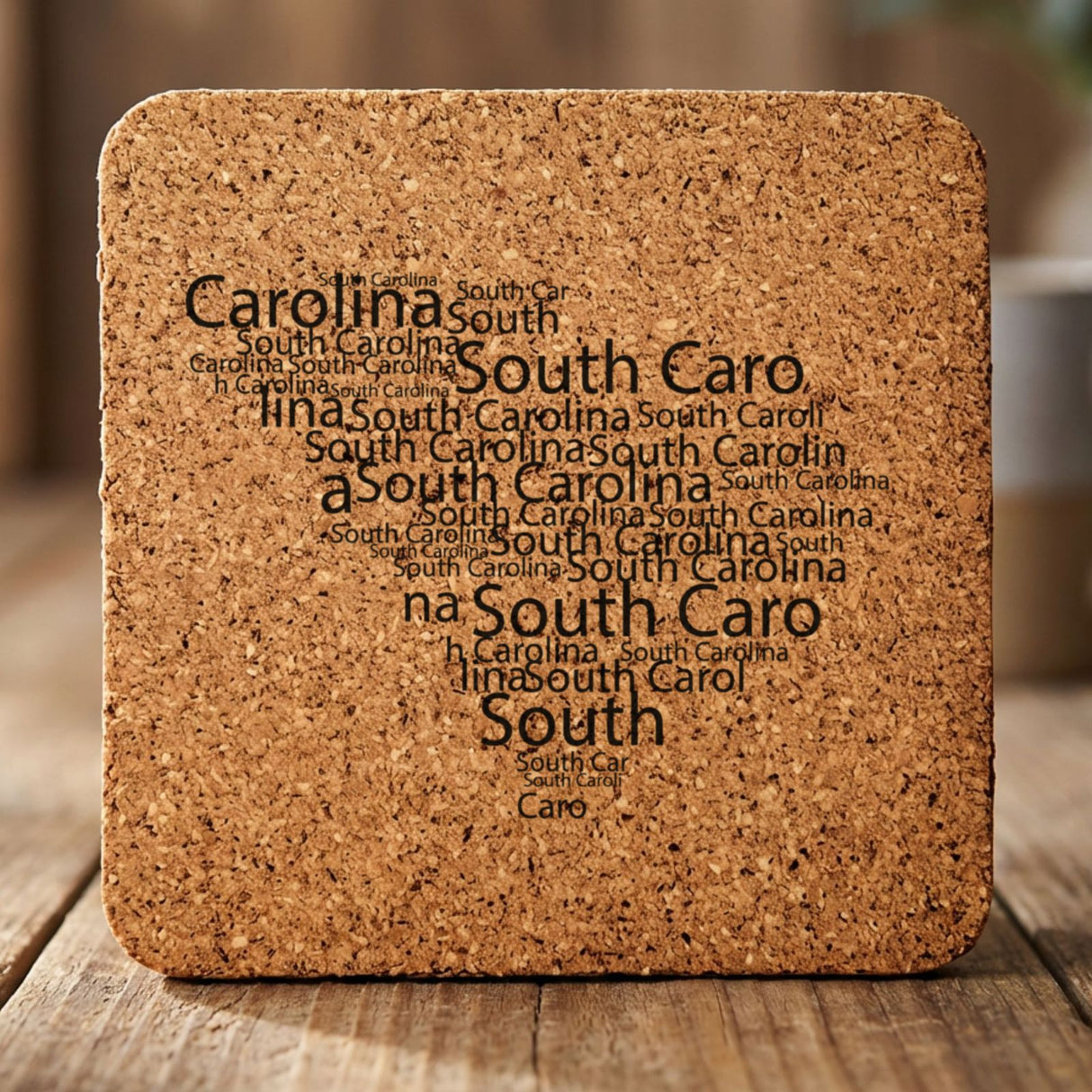 South Carolina square cork coaster engraved with a word cloud of repeating South Carolina text