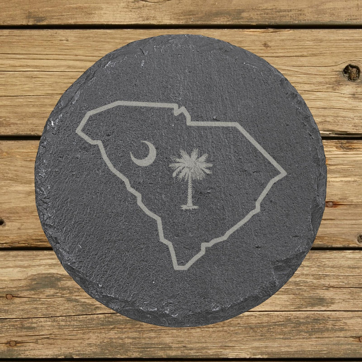 South Carolina round slate coaster engraved with the state outline, palmetto tree and crescent moon