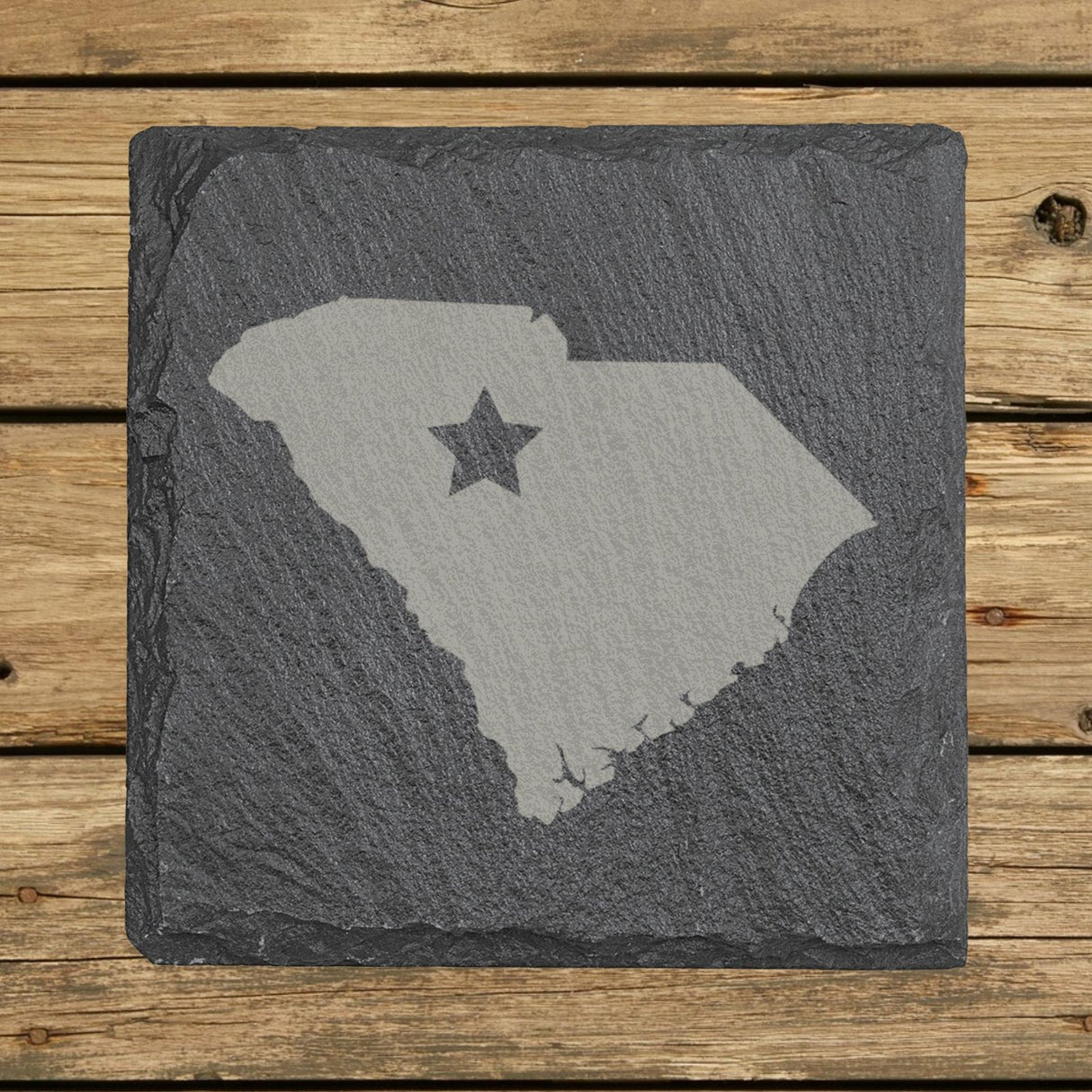 South Carolina square slate coaster engraved with the state shape and a star
